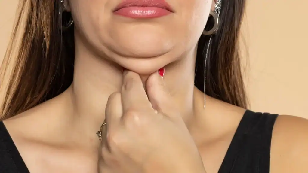 An image of a woman with double chin, sad, worried : Non Surgical Double Chin Removal Treatment in Lewisham, UK